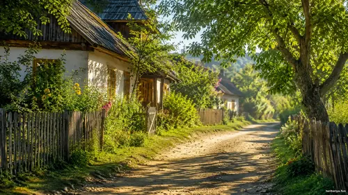 Села й затишок - Світло і тінь Сонячна сільська вуличка з хатинами, дерев’яними парканами, квітами