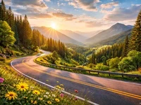 Гірська дорога серпантином на заході сонця, зелена долина та гори