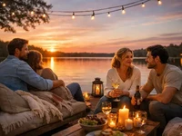 Четверо друзів відпочивають біля озера на терасі під час заходу сонця